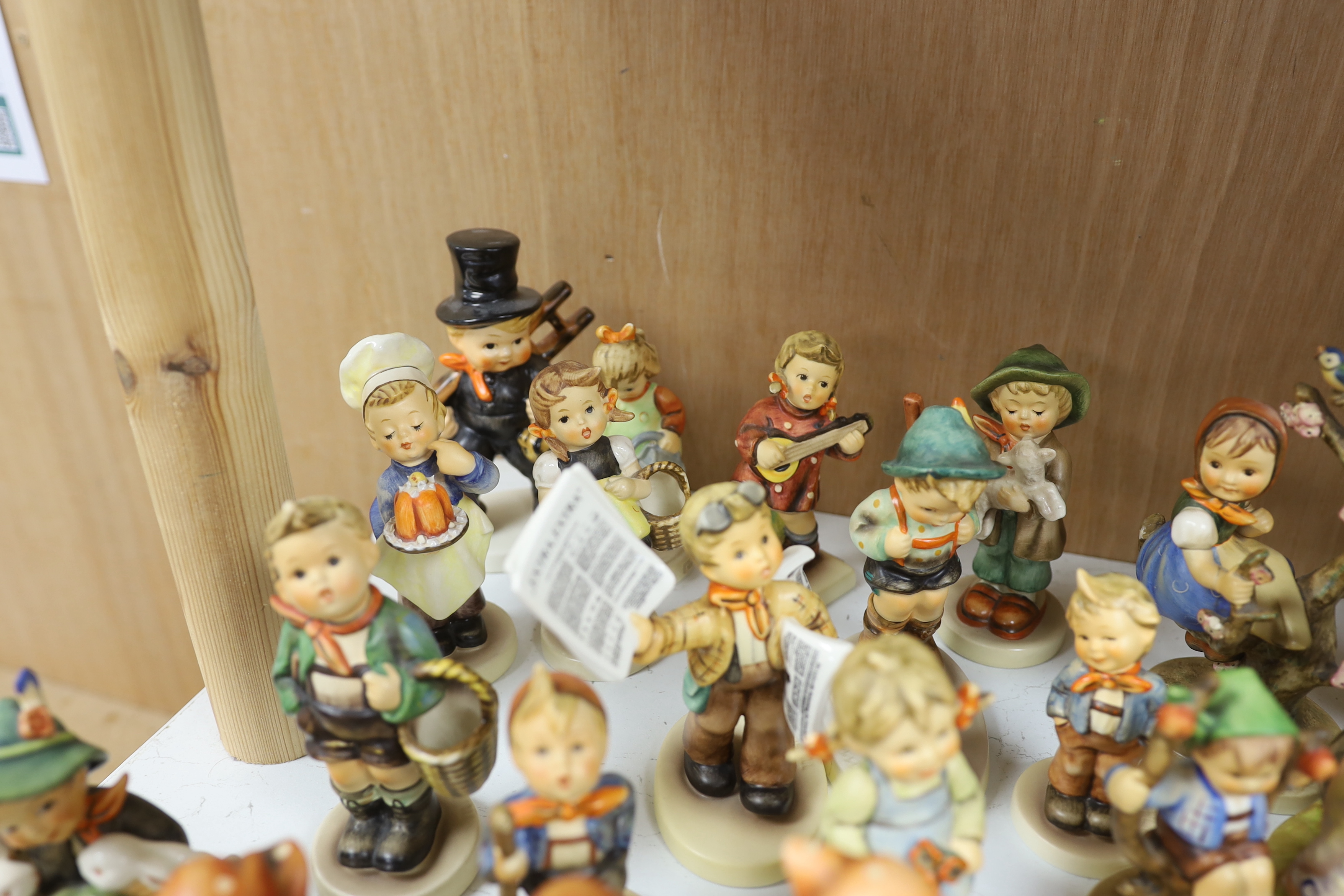 Twenty eight Goebel Hummel figures, largest 15cm high